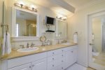 The upstairs master bathroom is very spacious with double sinks, shower, and jetted tub